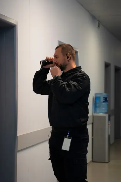 A vigilant BlueStar security guard on patrol at a facility.